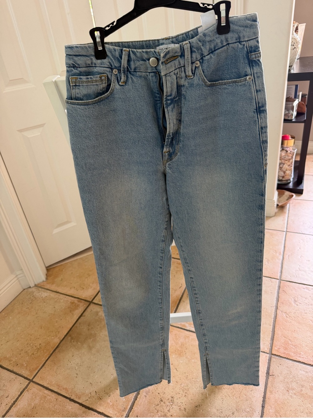 Good American Light Wash Jeans. Full length straight leg with split raw edge hem